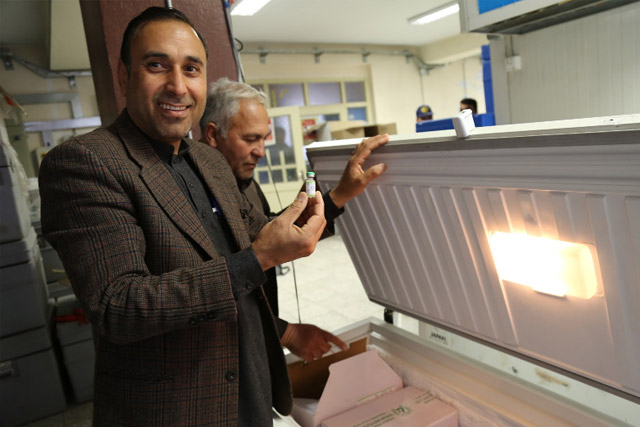 First there are the vaccines. Throughout the year, millions of doses of vaccines are stored in cold rooms across the country, ready to be used in immunization campaigns. Here, cold chain manager Ghulim Said shows oral polio vaccine vials − the primary vaccine used for polio eradication − which are stored in the Herat regional EPI vaccine storage facility.