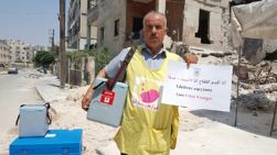 Hasan Kassar is a health worker who has been displaced from Al-Bab city in eastern rural Aleppo since 2013. “I fled with my family due to escalating violence in the area and I now deliver vaccines in the main health district in city of Aleppo,” said Hasan.   “While eastern Aleppo city was besieged, we did our best to deliver vaccines to health facilities there; however, we failed several times due to intensified fighting, lack of approvals from parties on the ground and the targeting of the health workers on several occasions,” added Hassan. 