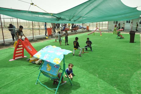 Play area inside the health centre; most children have not been immunized.