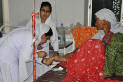 A women has her blood pressure counted in a civil hospital in Sanghar, Sindh