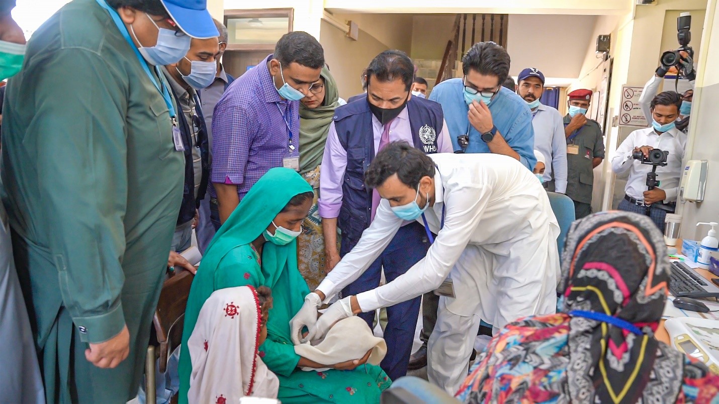 vaccinating-infant-in-flood