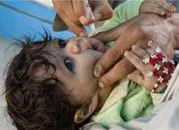 A child receiving polio drops