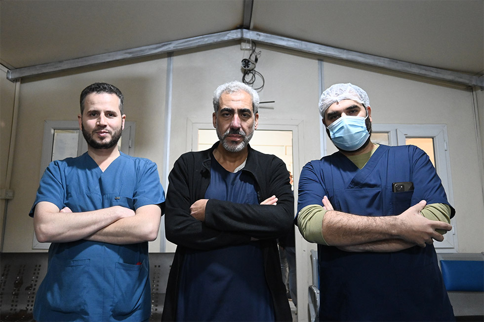 Left to right: Dr Husam Abob Alward, Dr Naser El Yousef and Dr Fares Al Shadidy, who work at the Bab al Salama Surgical Hospital. Photo credit: WHO/Mrinalini Santhanam 