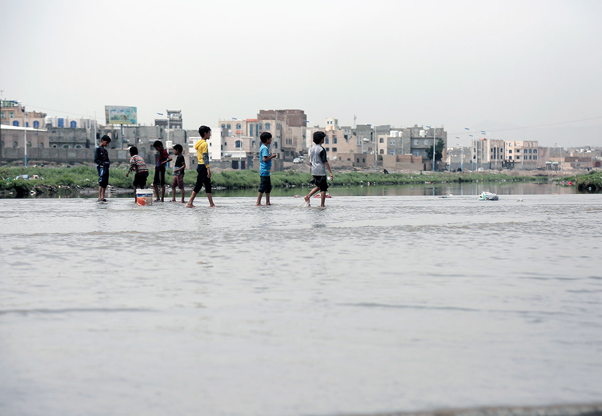  6 August 2024: children in an area affected by heavy rainfall and severe flooding in Sana'a, Yemen.  Photo credit: Mohammed Hamoud/Getty Images.